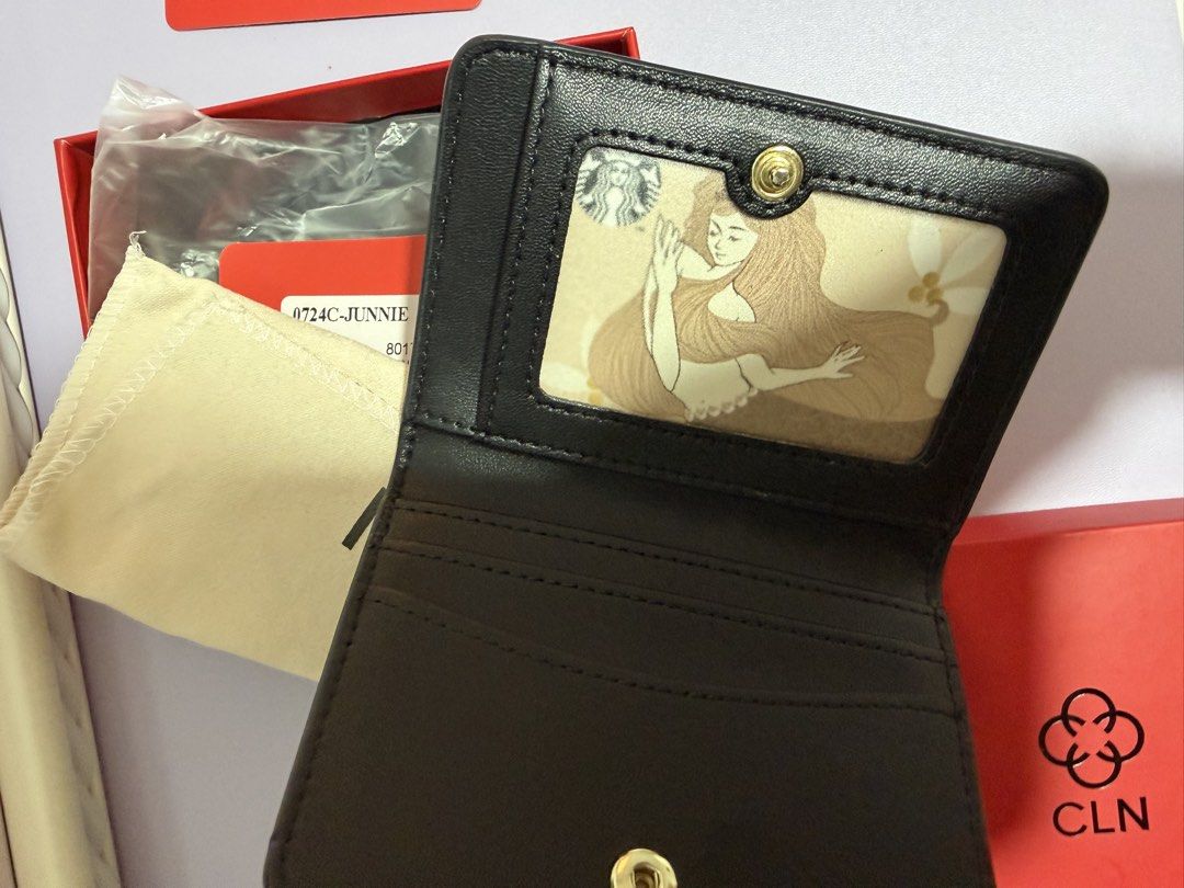 CLN Junnie Bi-fold Wallet (Category: Wallets & Card holders) located in Quezon City. Submitted by anneprelovess (Listing ID 1442977929, Image 2). Description: - CLN monogram bi-fold wallet - Includes original box and dust bag and paper bag - Black leather interior - Multiple card slots and clear ID window - Gold CLN logo on exterior - Ideal for everyday use.