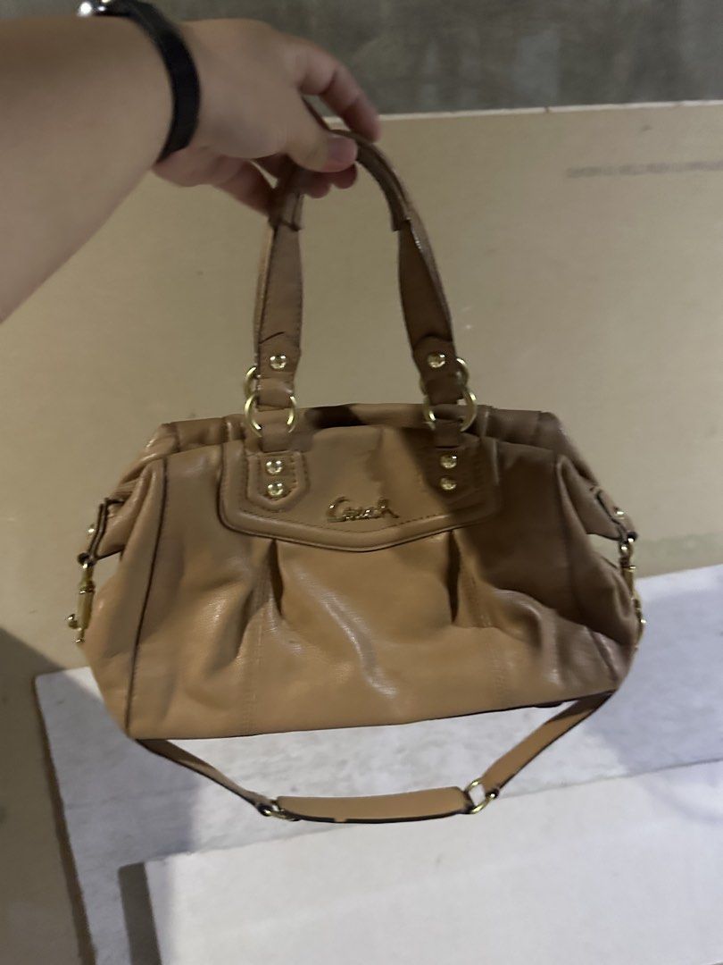 Coach Leather Handbag Tan Gold Hardware (Category: Luxury Bags & Wallets) located in Manila. Submitted by royalturtle-aead (Listing ID 1442932655, Image 1). Description: - Genuine tan leather Coach handbag - Elegant gold hardware details - Versatile with top handles and a detachable shoulder strap - Ample interior space for everyday essentials - Ideal for daily use - Minor signs of wear on leather and hardware, adding character.