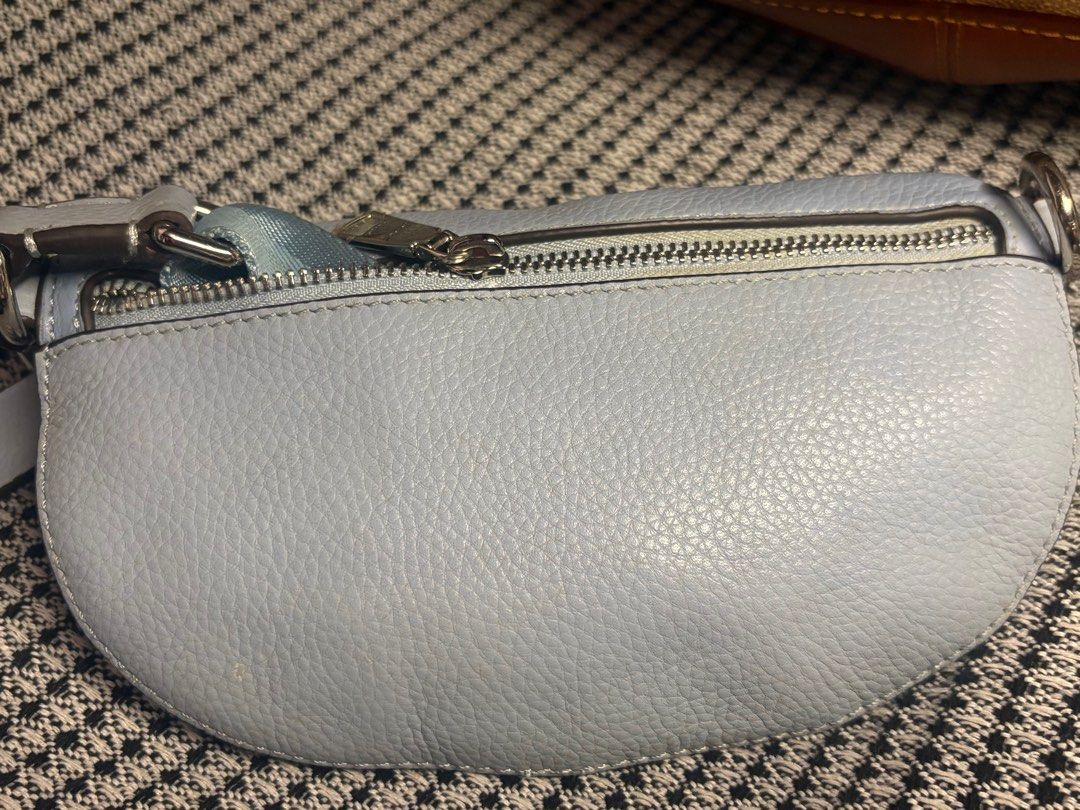 Coach Light Blue Leather Belt Bag (Category: Luxury Bags & Wallets) located in Tacloban City. Submitted by re_store23 (Listing ID 1443059534, Image 3). Description: - Light blue Coach belt bag - Pebbled leather material - Silver hardware and zipper - Includes Coach hang tag - Versatile: wear as waist bag or crossbody - Perfect for hands-free convenience -Coach collaboration with Selena Gomez. -Limited Edition. -Color is Skyblue. -manage your expe
