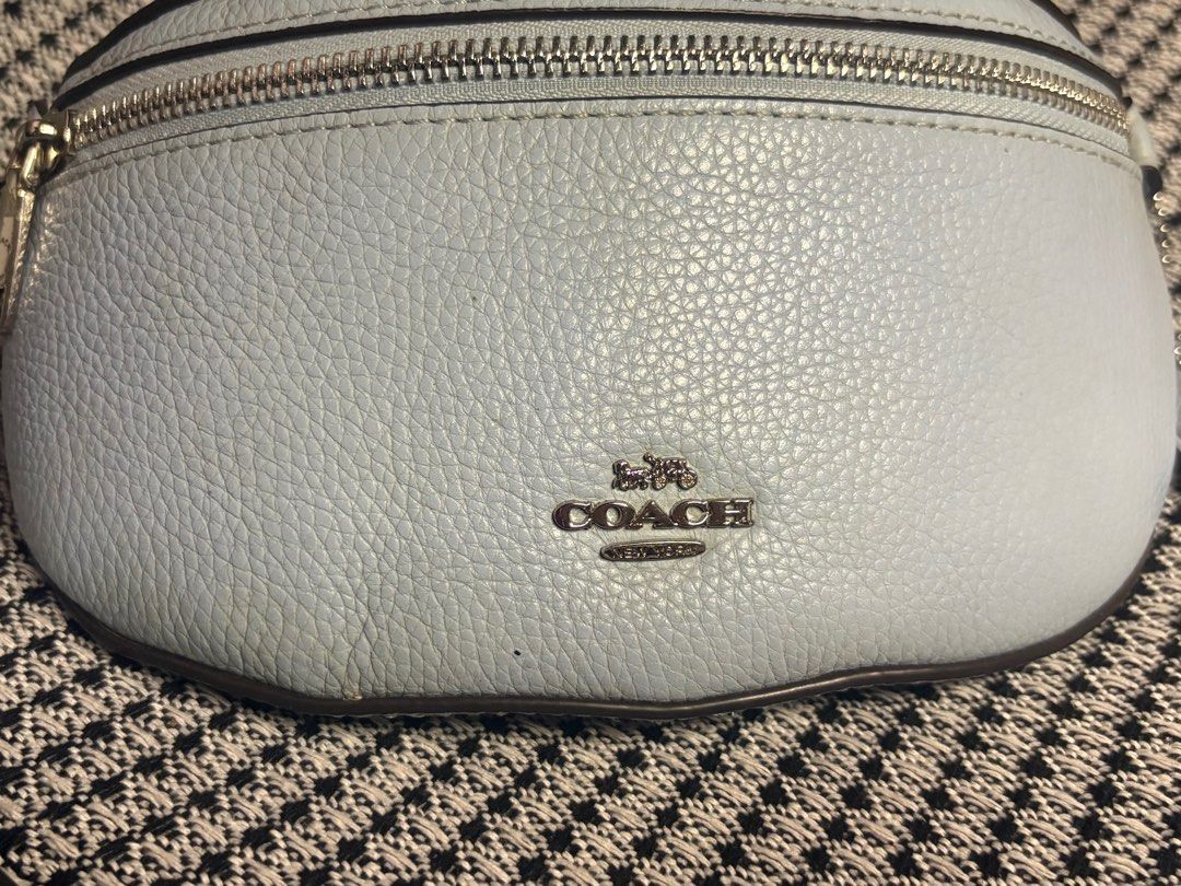 Coach Light Blue Leather Belt Bag (Category: Luxury Bags & Wallets) located in Tacloban City. Submitted by re_store23 (Listing ID 1443059534, Image 2). Description: - Light blue Coach belt bag - Pebbled leather material - Silver hardware and zipper - Includes Coach hang tag - Versatile: wear as waist bag or crossbody - Perfect for hands-free convenience -Coach collaboration with Selena Gomez. -Limited Edition. -Color is Skyblue. -manage your expe