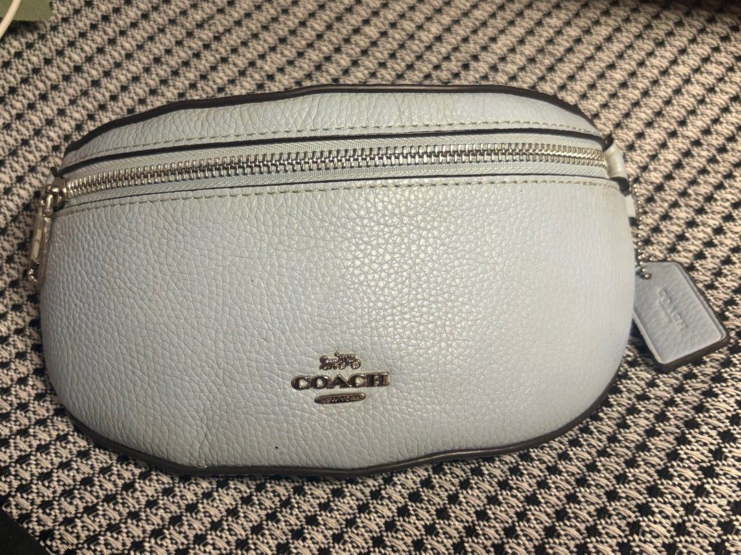 Coach Light Blue Leather Belt Bag (Category: Luxury Bags & Wallets) located in Tacloban City. Submitted by re_store23 (Listing ID 1443059534, Image 1). Description: - Light blue Coach belt bag - Pebbled leather material - Silver hardware and zipper - Includes Coach hang tag - Versatile: wear as waist bag or crossbody - Perfect for hands-free convenience -Coach collaboration with Selena Gomez. -Limited Edition. -Color is Skyblue. -manage your expe