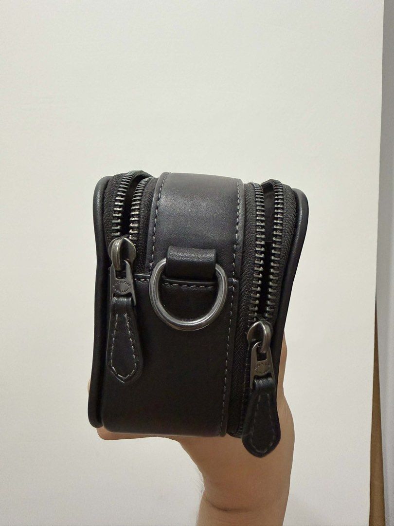 Coach Signature Monogram Pouch Bag (Category: Luxury Bags & Wallets) located in Makati City. Submitted by jelyss1 (Listing ID 1442963926, Image 3). Description: - Authentic Coach pouch - 100% original with paperbag and receipt bought from malaysia! - Signature monogram print - Black and grey colorway - Genuine leather trim and details - Secure zipper closure - Convenient side D-ring - Ideal for organizing essentials or as a compact travel bag - C