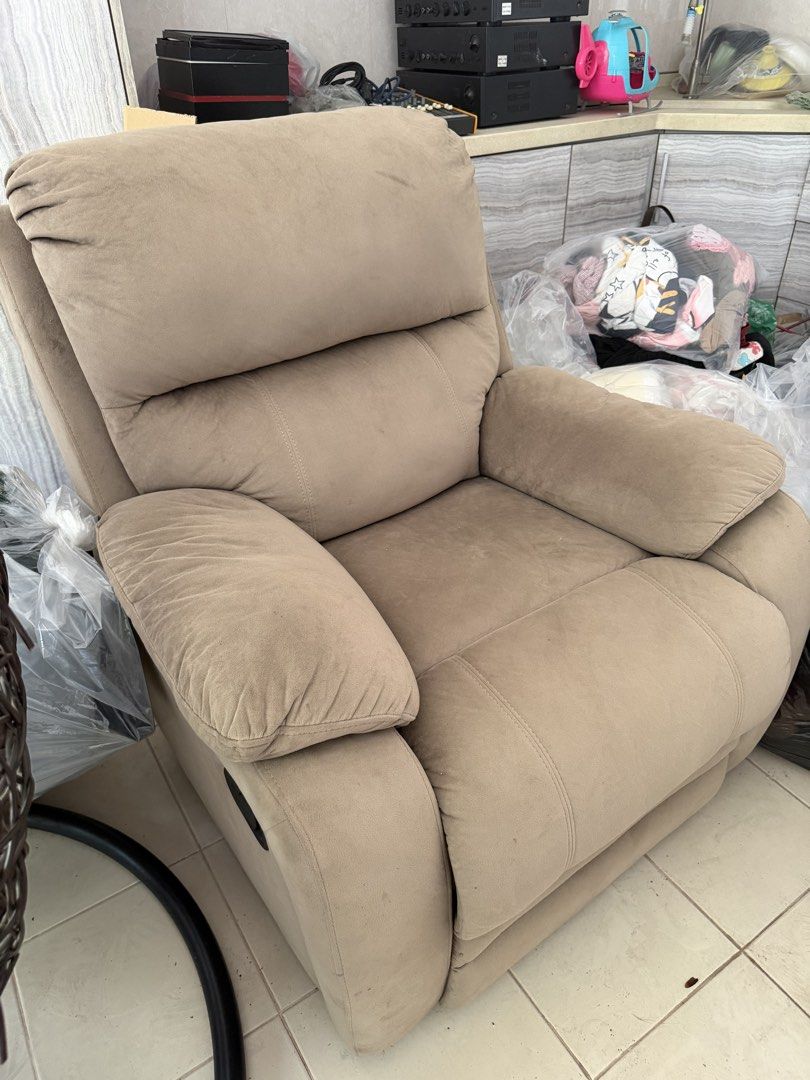Comfortable Fabric Recliner Chair (Category: Chairs) located in Cainta. Submitted by prinsessa01 (Listing ID 1443090245, Image 3). Description: - Comfortable fabric recliner chair - Neutral beige color - Padded armrests for extra comfort - Reclining backrest for ultimate relaxation - Ideal for living rooms or entertainment spaces - Easy to operate.