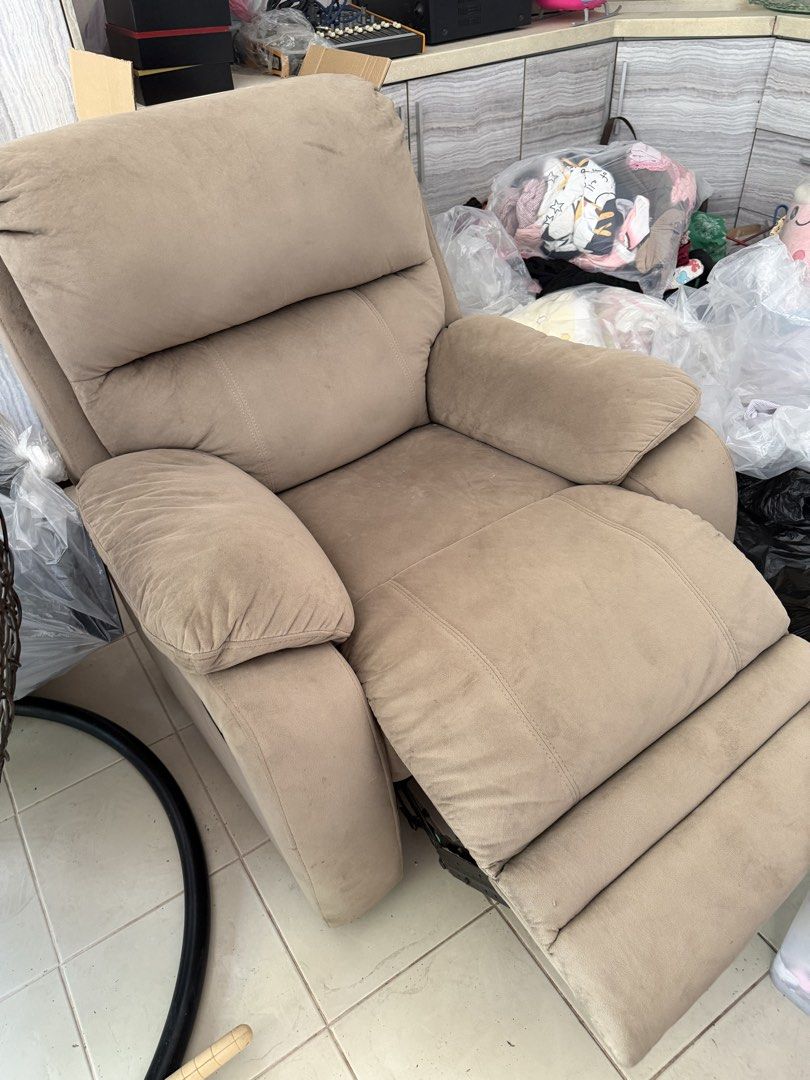 Comfortable Fabric Recliner Chair (Category: Chairs) located in Cainta. Submitted by prinsessa01 (Listing ID 1443090245, Image 2). Description: - Comfortable fabric recliner chair - Neutral beige color - Padded armrests for extra comfort - Reclining backrest for ultimate relaxation - Ideal for living rooms or entertainment spaces - Easy to operate.