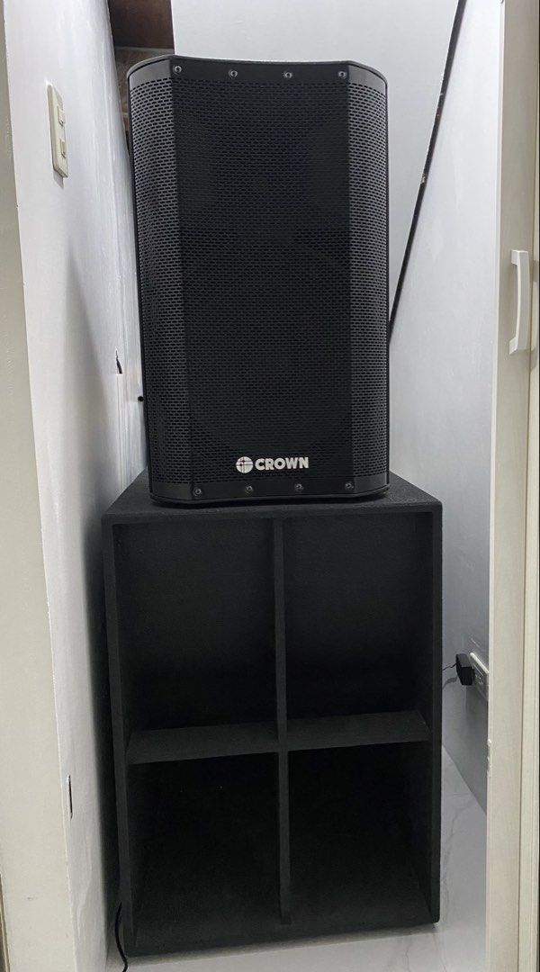 Crown Professional PA Speaker System with Subwoofer (Category: Soundbars, Speakers & Amplifiers) located in Quezon City. Submitted by fastdolphin_85dfc3 (Listing ID 1442991326, Image 2). Description: Selling a Crown PA speaker system. Includes one tall speaker and one large subwoofer. Both are black. The tall speaker has the Crown logo clearly visible. The subwoofer has a four-compartment design. Great for events or a home setup. Ready for a new 