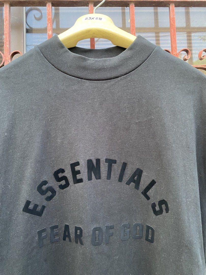 Fear of God Essentials Black Mock Neck T-Shirt (Category: Tshirts & Polo Shirts ) located in Cavite. Submitted by thriftz7 (Listing ID 1442983536, Image 2). Description: - Brand: Fear of God Essentials - Color: Black - Style: Mock Neck T-shirt - Features: Classic 'ESSENTIALS FEAR OF GOD' graphic on chest - Ideal for: Casual wear - Condition: Please check photos for details.