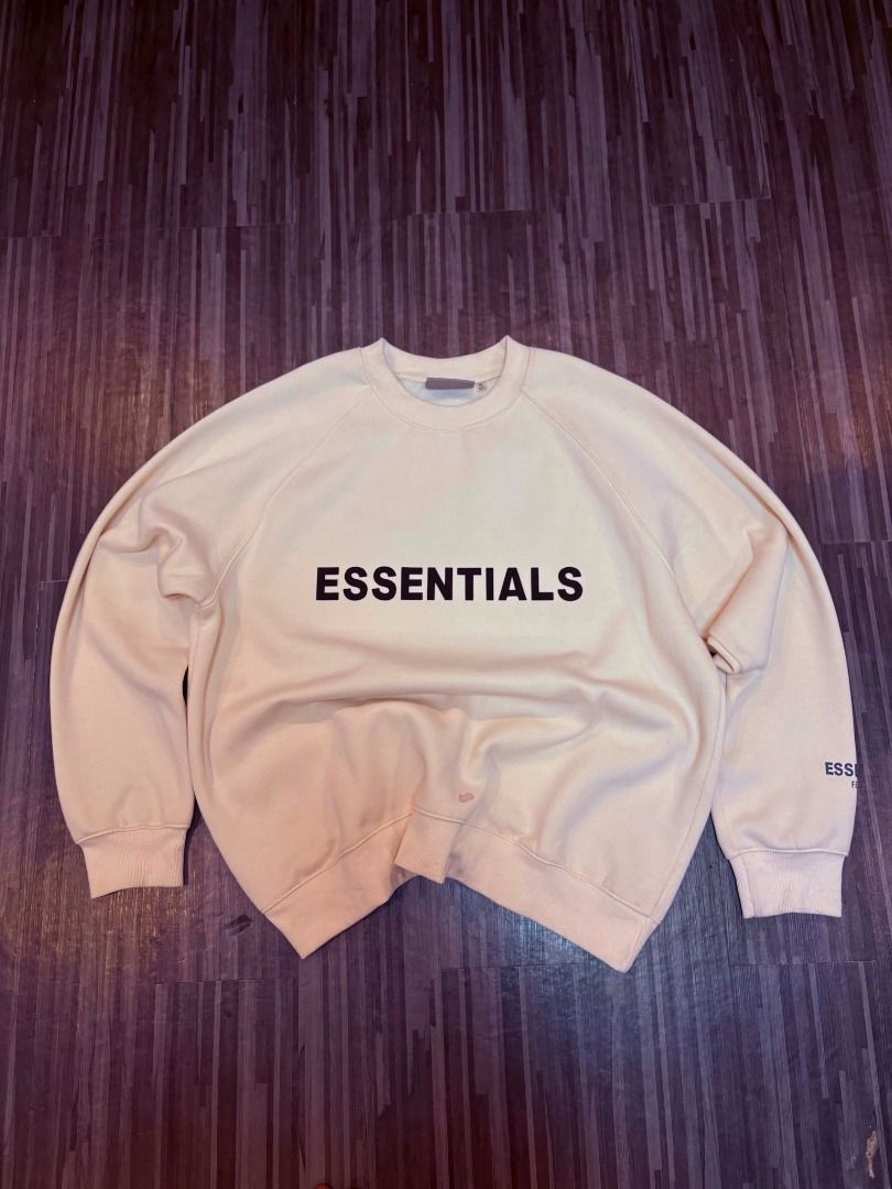Fear of God Essentials Cream Sweatshirt (Category: Coats, Jackets and Outerwear) located in Manila. Submitted by epic.zandra (Listing ID 1442978475, Image 3). Description: - Cream colored sweatshirt from Essentials - Features 'ESSENTIALS' logo printed across the chest - 'ESSENTIALS' and 'FEAR OF GOD' text printed on the sleeve - Raglan sleeves for a comfortable fit - Ribbed cuffs and hem for a classic look - Overall comfortable and relaxed fit be