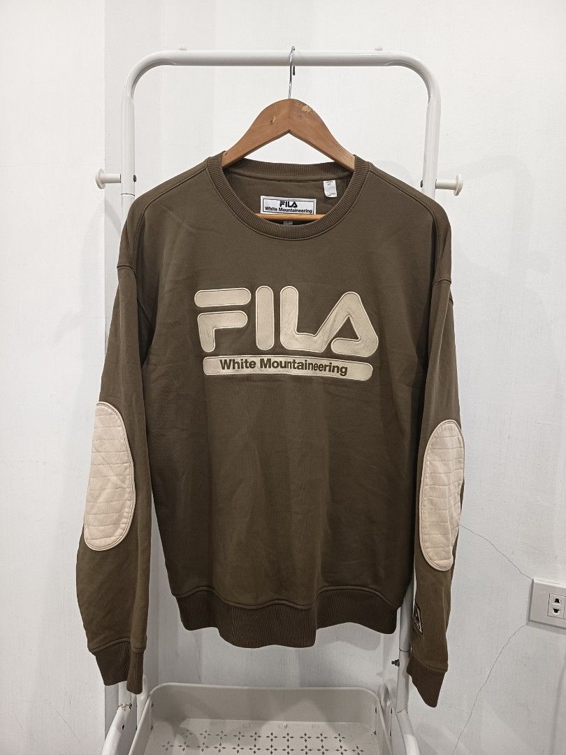 Fila x White Mountaineering Sweater (Category: Coats, Jackets and Outerwear) located in Dagupan City. Submitted by plugofallthreads (Listing ID 1443088695, Image 1). Description: Fila x White Mountaineering Sweater Size: Men's Small Loose Fit Width: 22 inches Length: 26 inches Sleeve Length: 30 inches Authentic In excellent condition. Olive Green. Embroidered. Price: Php 800 plus sf DM TO PURCHASE.