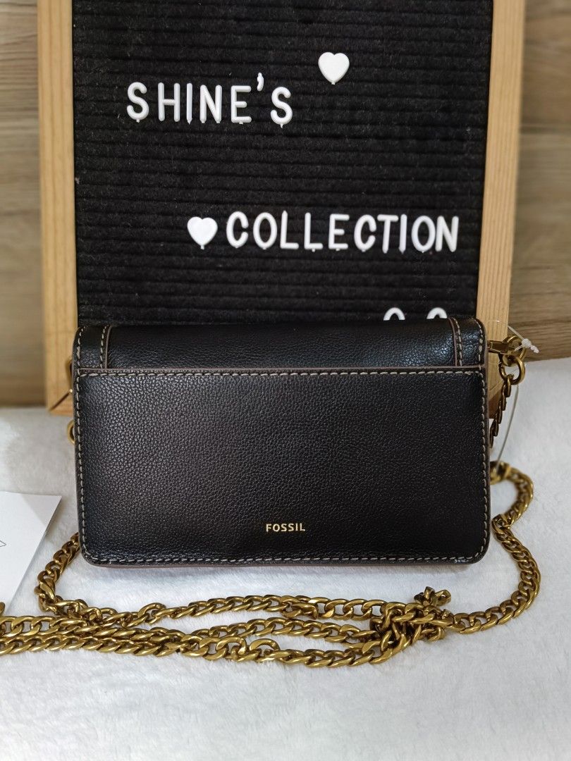 Fossil Black Leather Chain Crossbody Bag (Category: Cross-body Bags) located in Quezon City. Submitted by shinereign (Listing ID 1443021976, Image 3). Description: - Fossil black leather crossbody bag - Gold-tone chain strap - Secure turn-lock closure - Stylish stitching detail on front flap - Compact size, ideal for carrying essentials - Brand new with original tags and Fossil card.