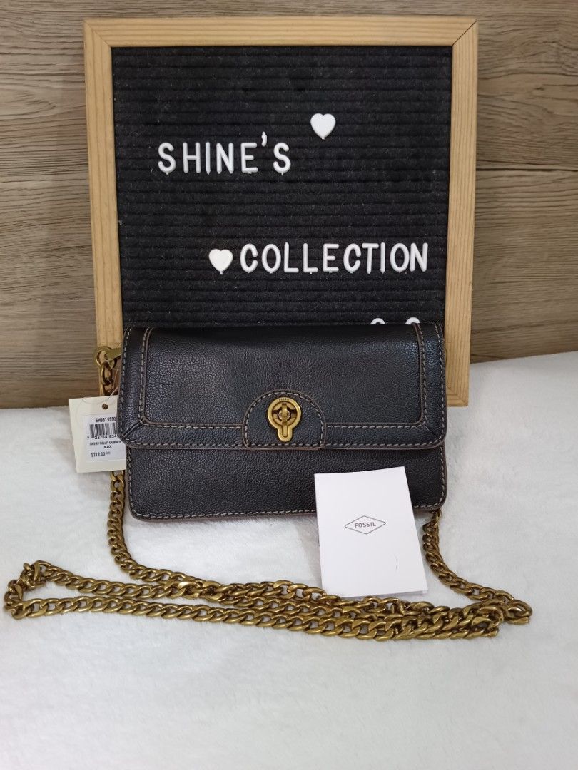 Fossil Black Leather Chain Crossbody Bag (Category: Cross-body Bags) located in Quezon City. Submitted by shinereign (Listing ID 1443021976, Image 1). Description: - Fossil black leather crossbody bag - Gold-tone chain strap - Secure turn-lock closure - Stylish stitching detail on front flap - Compact size, ideal for carrying essentials - Brand new with original tags and Fossil card.