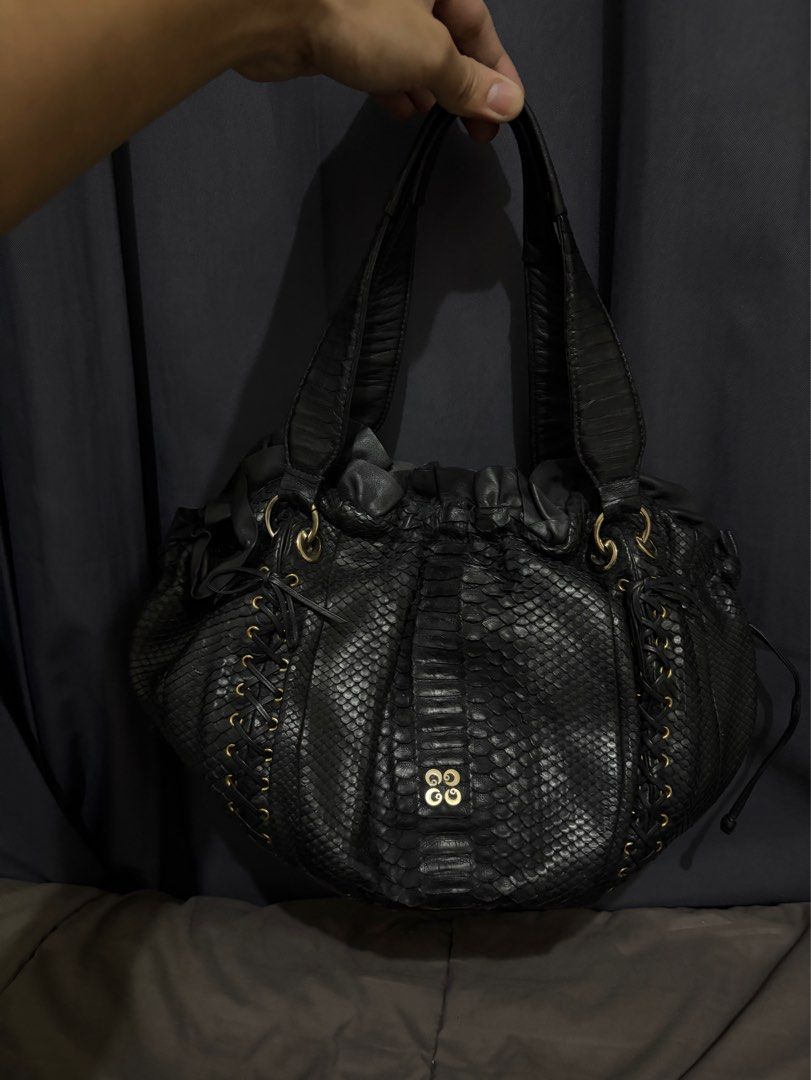 Genuine Python Shoulder Hobo Bag (Category: Luxury Bags & Wallets) located in Munoz. Submitted by lolongs (Listing ID 1443059477, Image 1). Description: - Genuine Python Skin - Exotic Skin / Snake Skin - Sobrang ganda nito. High quality ng snake leather ang ginamit. Ganda pa ng design. - Gold na gold pa ang mga hardwares - Excellent condition! Pwede sa maselan at maarte! - Please see pictures for reference - Perfect for office bag din.