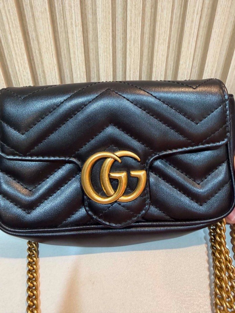 Gucci Marmont Mini Bag Black Chevron Leather (Category: Luxury Bags & Wallets) located in Quezon City. Submitted by kymis (Listing ID 1443119336, Image 2). Description: - Authentic Gucci Marmont mini bag - Black chevron leather with iconic gold GG hardware - Signature heart detail on the back - Versatile chain strap for shoulder or crossbody wear - Comes with original dust bag - Interior features a small Gucci tag for authenticity.