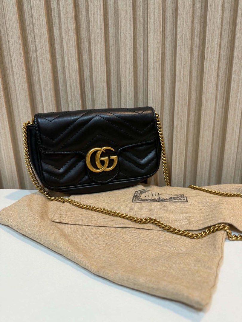 Gucci Marmont Mini Bag Black Chevron Leather (Category: Luxury Bags & Wallets) located in Quezon City. Submitted by kymis (Listing ID 1443119336, Image 1). Description: - Authentic Gucci Marmont mini bag - Black chevron leather with iconic gold GG hardware - Signature heart detail on the back - Versatile chain strap for shoulder or crossbody wear - Comes with original dust bag - Interior features a small Gucci tag for authenticity.