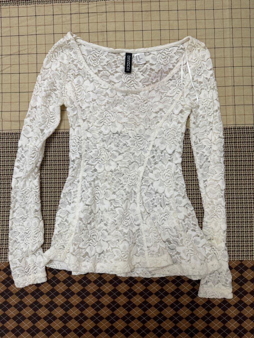 H&M Divided White Lace Long Sleeve Top (Category: Longsleeves) located in Quezon City. Submitted by m3gan8 (Listing ID 1443067981, Image 1). Description: - H&M Divided white lace top - Size XS - Long sleeves - Fitted silhouette - Delicate floral lace pattern - Ideal for layering over camisoles or bralettes.