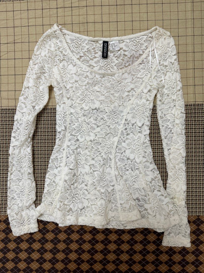 H&M Divided White Lace Long Sleeve Top (Category: Longsleeves) located in Quezon City. Submitted by m3gan8 (Listing ID 1443067981, Image 2). Description: - H&M Divided white lace top - Size XS - Long sleeves - Fitted silhouette - Delicate floral lace pattern - Ideal for layering over camisoles or bralettes.