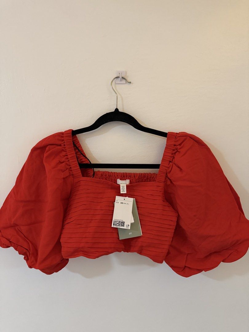 H&M Red Puff Sleeve Square Neck Crop Top (Category: Blouses) located in Bacoor. Submitted by conclaseph (Listing ID 1442947448, Image 2). Description: - Trendy red crop top - Statement puff sleeves - Flattering square neckline - Comfortable smocked bodice - Brand new with tags attached - Perfect for dressing up or down - Pairs well with jeans or skirts.