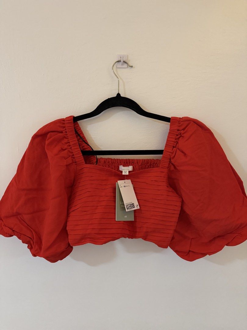 H&M Red Puff Sleeve Square Neck Crop Top (Category: Blouses) located in Bacoor. Submitted by conclaseph (Listing ID 1442947448, Image 1). Description: - Trendy red crop top - Statement puff sleeves - Flattering square neckline - Comfortable smocked bodice - Brand new with tags attached - Perfect for dressing up or down - Pairs well with jeans or skirts.