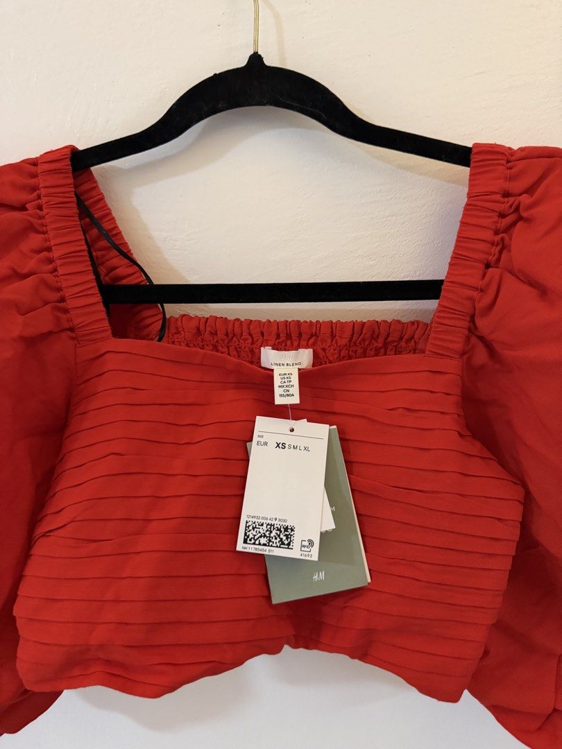 H&M Red Puff Sleeve Square Neck Crop Top (Category: Blouses) located in Bacoor. Submitted by conclaseph (Listing ID 1442947448, Image 3). Description: - Trendy red crop top - Statement puff sleeves - Flattering square neckline - Comfortable smocked bodice - Brand new with tags attached - Perfect for dressing up or down - Pairs well with jeans or skirts.