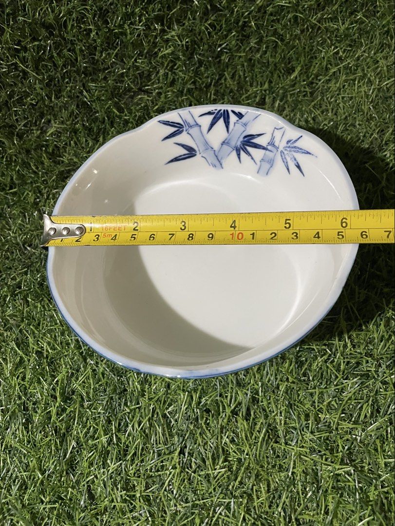 Japanese Style Bamboo Ceramic Bowl (Category: Other Kitchenware & Tableware) located in Quezon City. Submitted by lanqcqc (Listing ID 1443001271, Image 2). Description: Ceramic bowl with a blue striped pattern on the outside. Features a blue bamboo design on the inside rim. Measures approximately 6 inches in diameter and 2.5 inches in height. Great for serving rice or soup. Adds a traditional touch to your dining table. japan surplus / pre-loved;