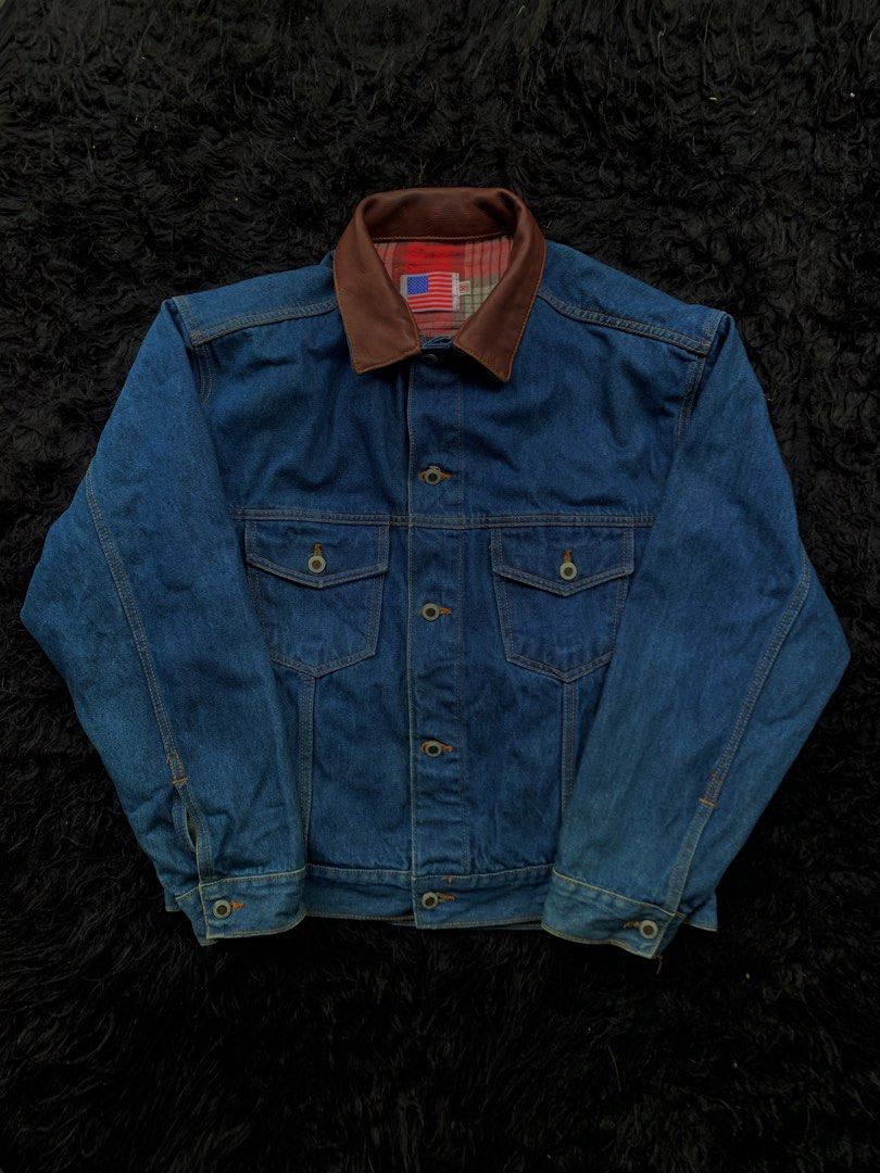 JIHYU JEANS Denim Jacket with Brown Collar (Category: Coats, Jackets and Outerwear) located in Manila. Submitted by 0thrift_n_isaw (Listing ID 1443122473, Image 3). Description: - Classic blue denim jacket - Features a stylish brown collar - Cozy plaid lining for added warmth and style - Two chest pockets with secure button closures - Easy button-up front - Versatile for layering over any outfit - A timeless piece that pairs well with everything.