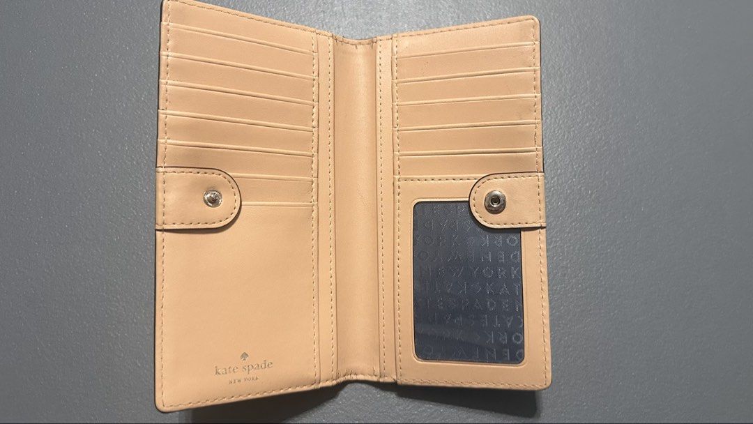 Kate Spade New York Leather Wallet (Category: Wallets & Card holders) located in Quezon City. Submitted by mystash2.o (Listing ID 1443076434, Image 3). Description: - Classic Kate Spade wallet - Navy blue leather - Multiple card slots - Back zip pocket - Gold hardware - Clean interior - Great for organizing essentials.