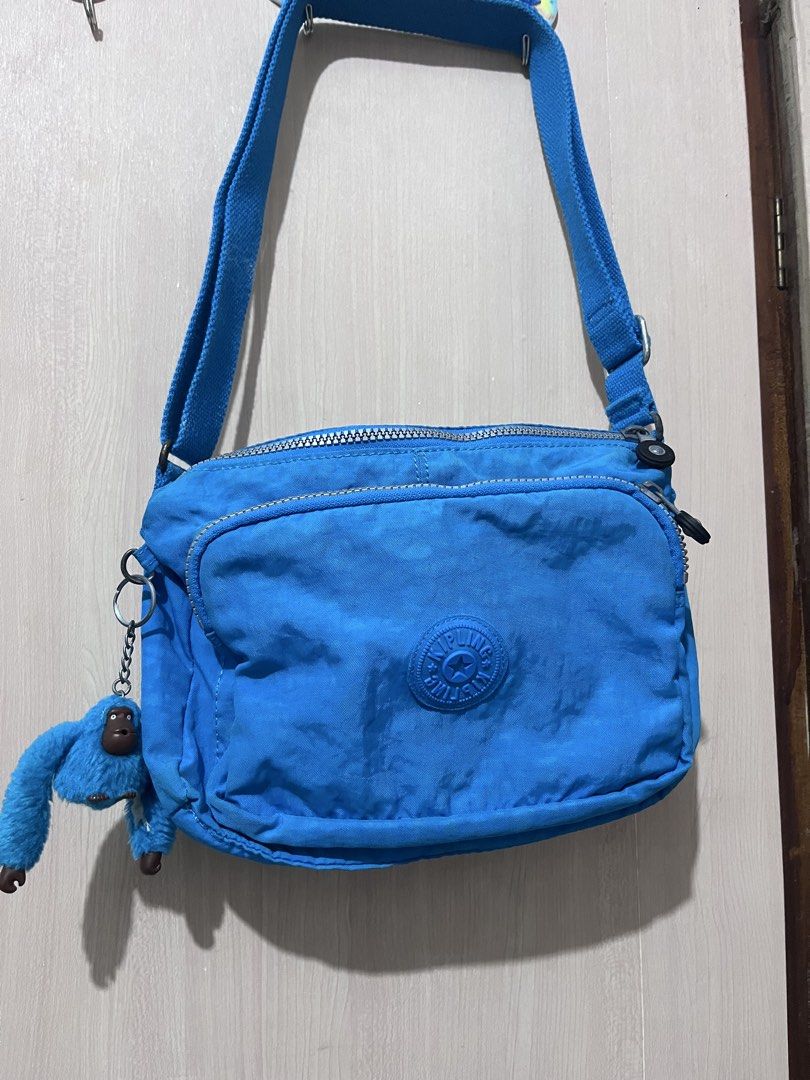 Kipling Reth Blue crossbody bag |free shipping (Category: Cross-body Bags) located in Iloilo. Submitted by youronlinesister (Listing ID 1443065722, Image 1). Description: Kipling crossbody bag 3 zipper compartments Light weight Daming mailalagay Preloved with flaws Monkeys name di n mabasa Etiketa sa loob di na din halos mabasa May yellow stains sa likod see pic Metal hardware may tarnish Actual color of the bag last pic taken online hindi kase m