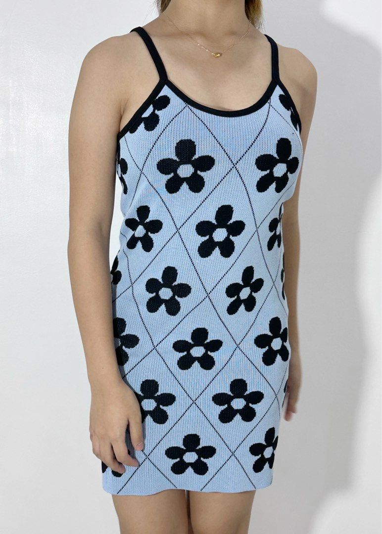 Light Blue Floral Knit Mini Dress (Category: Dresses) located in Agdangan. Submitted by mvania (Listing ID 1443010880, Image 1). Description: - Light blue knit mini dress - Black floral pattern - Diamond knit design - Spaghetti straps - Scoop neckline - Fitted and stretchy - Versatile for casual or night out.