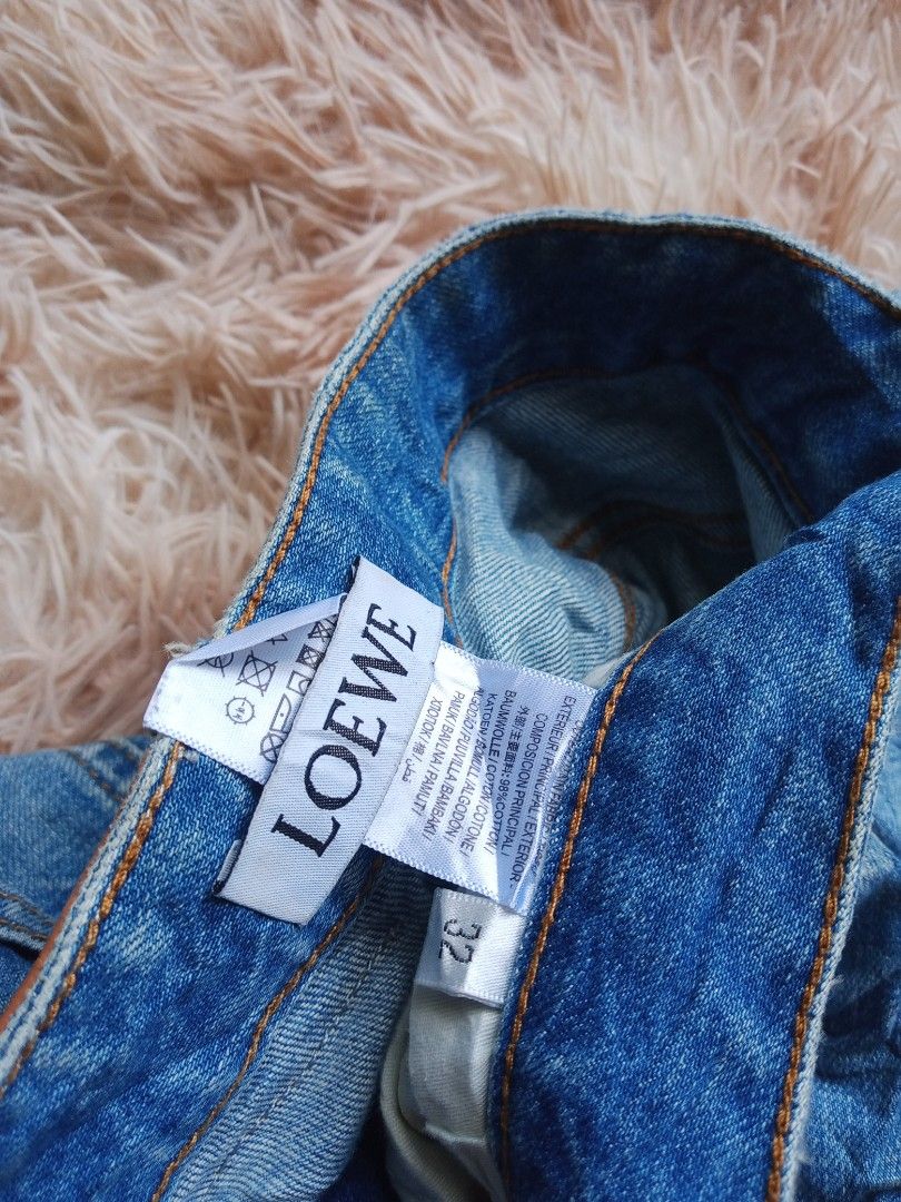 LOEWE Blue Denim Jeans Size 32 (Category: Jeans) located in Boston. Submitted by johnpaulvi30029 (Listing ID 1443009417, Image 3). Description: - Brand: LOEWE - Color: Blue Denim - Size: 32 - Fit: Classic Straight Leg - Features: Iconic LOEWE logo on back pocket, Leather patch at waist - Occasion: Great for everyday wear - Inquiries: Feel free to ask any questions!.