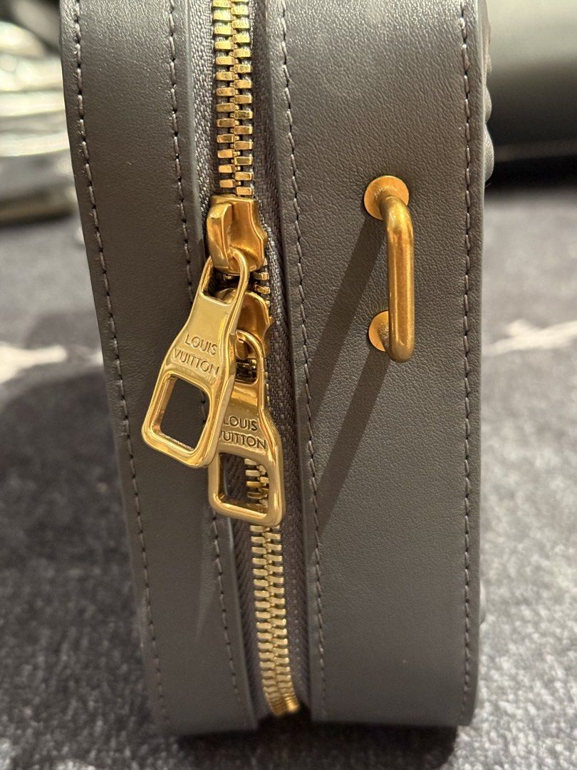 Louis Vuitton Grey Monogram Embossed Crossbody Bag (Category: Luxury Bags & Wallets) located in Caloocan City. Submitted by mightbagsph23 (Listing ID 1442994593, Image 3). Description: - Authentic Louis Vuitton crossbody bag - Classic monogram pattern embossed all over - Elegant gold hardware details - Adjustable strap for comfortable wear - Comes with original dust bag - Made in France - Ideal for everyday use.