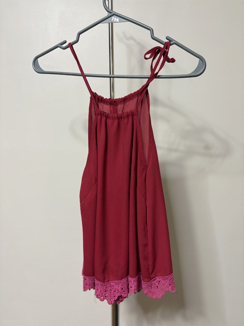 Maroon Halter Neck Top with Lace Trim (Category: Sleeveless) located in Taguig. Submitted by pomupuff (Listing ID 1443060259, Image 1). Description: - Cute maroon top - Ties at the neck - Sheer overlay on the top part - Lace trim at the hem - Estimated size: Small to Medium - Versatile for night outs or casual wear.