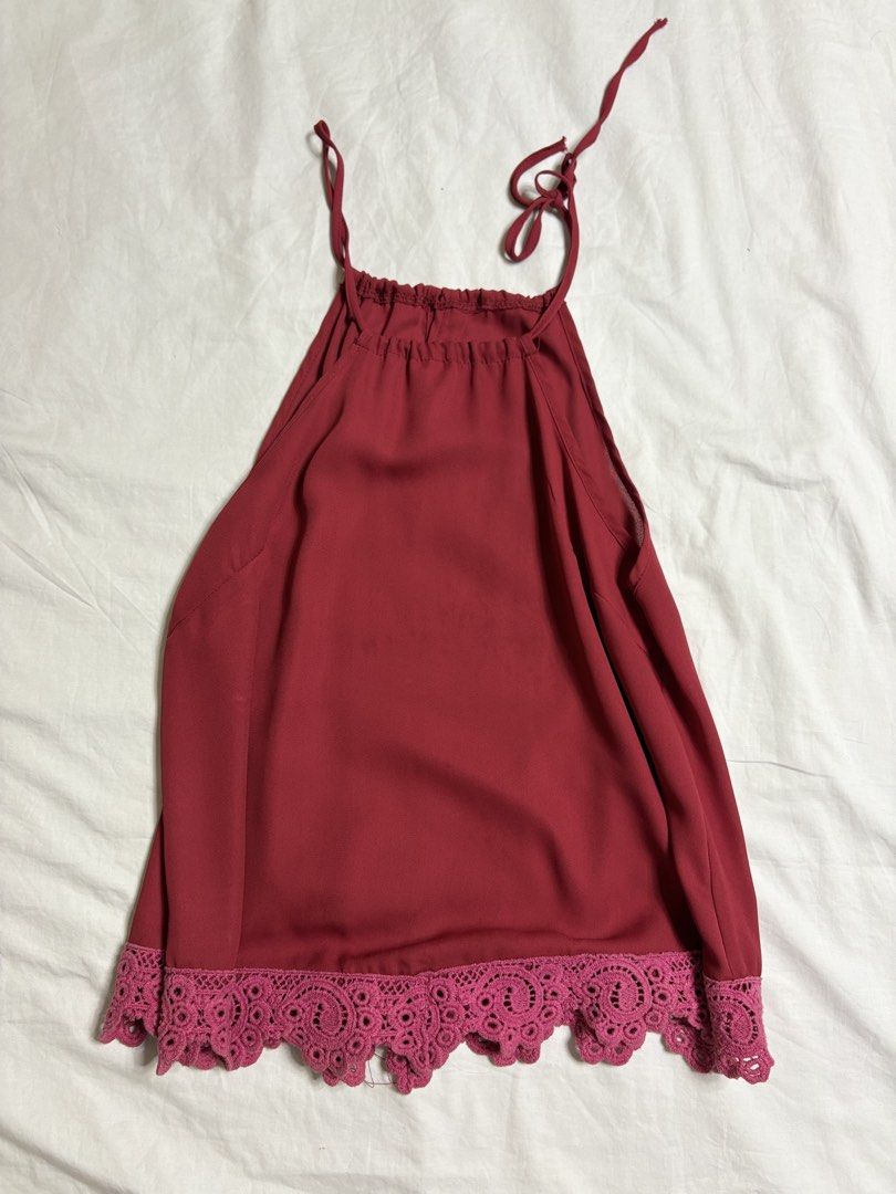 Maroon Halter Neck Top with Lace Trim (Category: Sleeveless) located in Taguig. Submitted by pomupuff (Listing ID 1443060259, Image 2). Description: - Cute maroon top - Ties at the neck - Sheer overlay on the top part - Lace trim at the hem - Estimated size: Small to Medium - Versatile for night outs or casual wear.