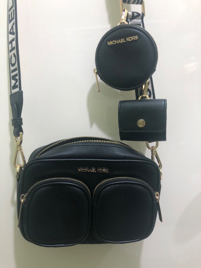 Michael Kors Black Leather Camera Bag with Coin Pouch (Category: Luxury Bags & Wallets) located in Las Pinas. Submitted by xyhaydiex (Listing ID 1442994969, Image 1). Description: - Authentic Michael Kors black leather crossbody bag - Two front zip pockets and a main zip compartment - Includes a detachable coin pouch and a smaller card holder - Adjustable strap with Michael Kors branding - Elegant gold hardware details.