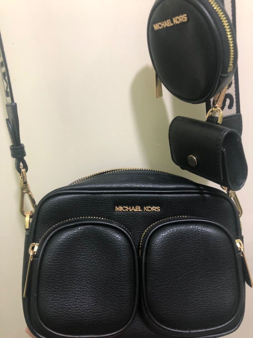 Michael Kors Black Leather Camera Bag with Coin Pouch (Category: Luxury Bags & Wallets) located in Las Pinas. Submitted by xyhaydiex (Listing ID 1442994969, Image 2). Description: - Authentic Michael Kors black leather crossbody bag - Two front zip pockets and a main zip compartment - Includes a detachable coin pouch and a smaller card holder - Adjustable strap with Michael Kors branding - Elegant gold hardware details.
