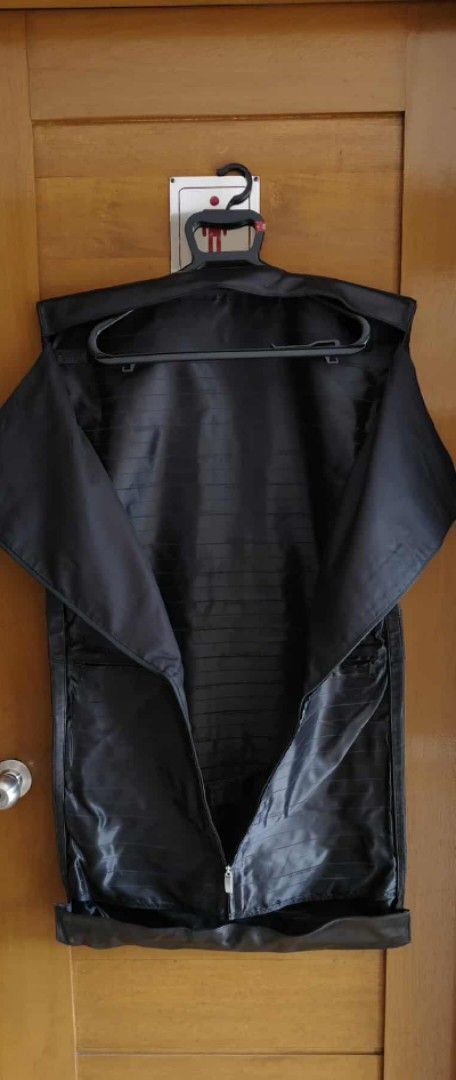 Mini Cooper Black leather Garment Bag (Category: Luxury Bags & Wallets) located in Taguig. Submitted by thrifthub.ph (Listing ID 1443033498, Image 2). Description: - Black garment bag with Mini Cooper logo - Zipper closure for secure storage - Folds up easily for convenient storage - Ideal for travel or protecting garments - Approximate dimensions: 20" W x 24" H (when folded).