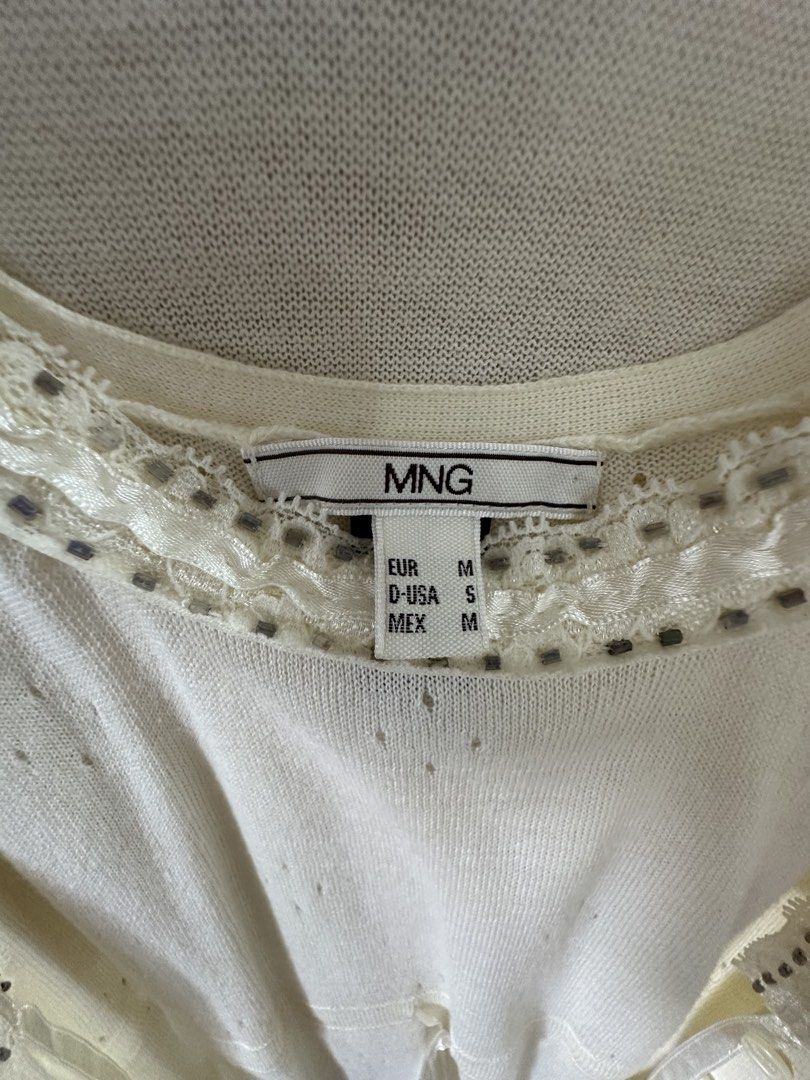 MNG Cream Cardigan and Top Set (Category: Longsleeves) located in Manila. Submitted by aj.honey (Listing ID 1442951136, Image 3). Description: - Cream MNG cardigan and matching sleeveless top set. - Cardigan features button closures and decorative neckline trim. - Top is a simple sleeveless design. - Both pieces made from lightweight knit material. - Perfect for layering or wearing individually. - Made in Hong Kong..