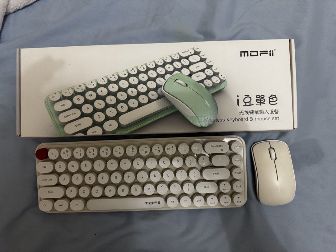 MOFII Wireless Keyboard and Mouse Set - Retro Round Keys (Category: Computer Keyboard) located in Caloocan City. Submitted by maimaibtsta0 (Listing ID 1443068521, Image 1). Description: - Cute MOFII wireless keyboard and mouse set - Aesthetic retro round keycaps - Lovely pastel green color - Includes both keyboard and mouse - Great for enhancing your desk setup - In good working condition.