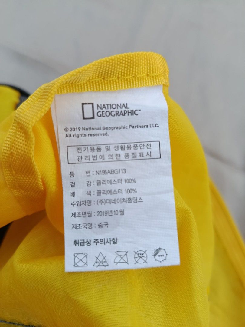 National Geographic Yellow Duffel Bag (Category: Backpacks) located in Jasaan. Submitted by eliwhomp (Listing ID 1443048624, Image 3). Description: - Vibrant yellow duffel bag with stylish grey accents. - Features the iconic National Geographic logo. - Equipped with two comfortable carry handles. - Folds compactly for convenient storage when not in use. - Ideal size for weekend getaways or gym sessions..