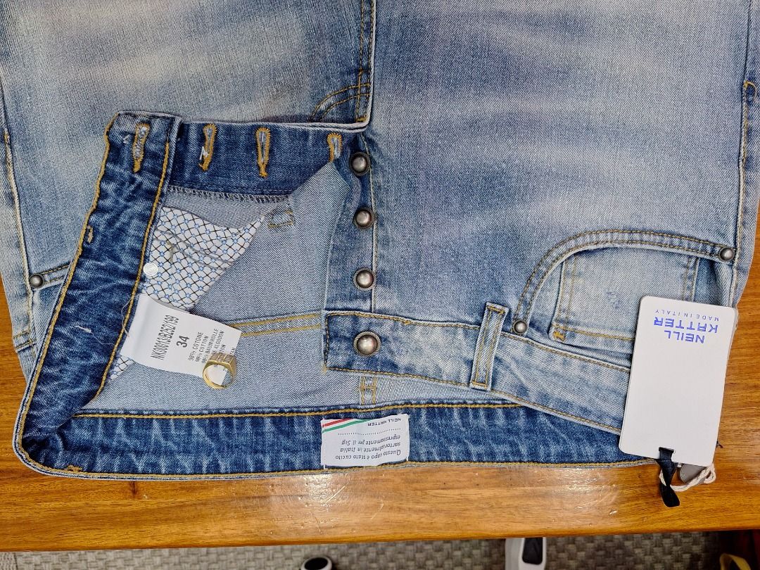 NEILL KATTER Light Wash Denim Jeans (Category: Jeans) located in Tuguegarao City. Submitted by seagull2026 (Listing ID 1442951390, Image 2). Description: - Light wash denim jeans by NEILL KATTER - Distressed look with front rips - Button fly closure - Classic five-pocket styling - Made in Italy - Ideal for casual wear - Like new (with original tag) - waist 34 inches.
