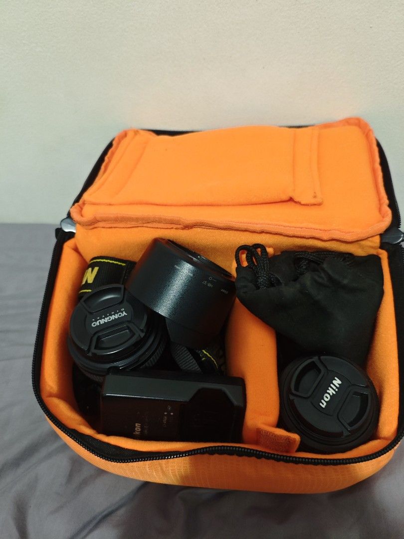 Nikon D5100 with 3 lenses (Category: Cameras) located in Quezon City. Submitted by brixl (Listing ID 1443053054, Image 2). Description: NIKON 5100 Nikon 18-55mm lens kit lens Nikon 55-200 mm kit lens Youngnuo 35mm bought last 2022 Battery Grip 2 battery 1 charger Lens filter Camera Bag NO memory card. Issue: One battery need replacement mild swelling. 200 mm lens mild dents due to it was stuck and not using. For the Yongnuo lens, I barely used it