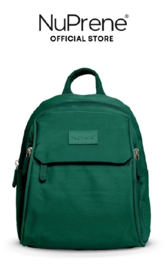 NuPrene Dark Green Water Resistant Mini Raya Backpack (Category: Backpacks) located in Davao. Submitted by jilly07 (Listing ID 1442978192, Image 1). Description: - Dark green NuPrene mini backpack - Water-resistant exterior - Front zip pocket - Dual zip pockets - Main compartment with interior zip pocket divider - Adjustable cotton straps with metal buckles - Back phone pocket - Ideal for everyday use Used only once to try. Bought in Nuprene RFS: