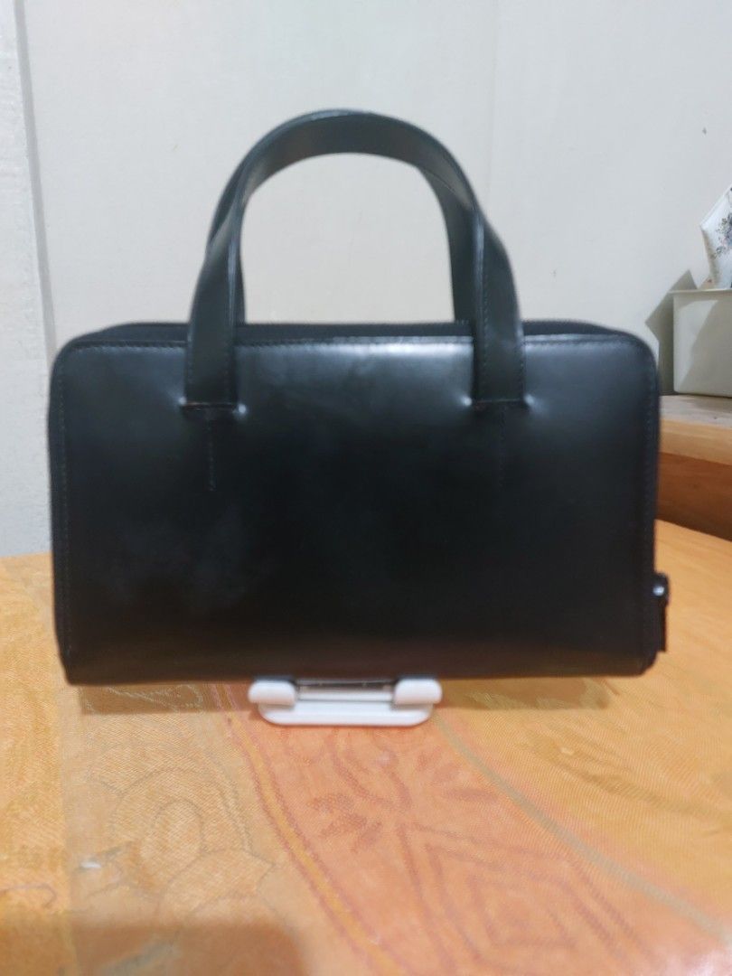 PALOMA PICASSO vintage wallet (Category: Wallets & Card holders) located in Las Pinas. Submitted by jmproperties (Listing ID 1443055660, Image 2). Description: Black Paloma Picasso wallet vintage zips around with handles 8 credit card slots inside and 1 inside zip closure. vintage but in very good condition. size : 22 cm x 12 cm.