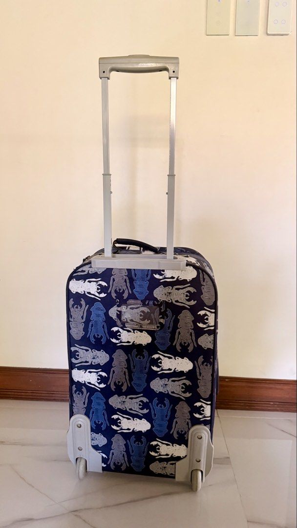 Pottery Barn Kids Luggage Suitcase (Category: Luggage) located in Quezon City. Submitted by closetcleanupfairy (Listing ID 1442966418, Image 3). Description: - Adorable rolling suitcase designed for kids - Features a fun and colorful bug pattern - Equipped with a retractable handle for easy maneuvering - Smooth-rolling wheels for effortless transport - Ideal for sleepovers, playdates, and short getaways - Made from durable materials for long-last