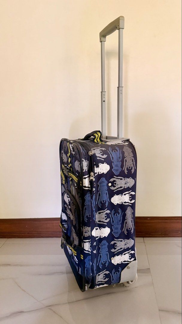 Pottery Barn Kids Luggage Suitcase (Category: Luggage) located in Quezon City. Submitted by closetcleanupfairy (Listing ID 1442966418, Image 2). Description: - Adorable rolling suitcase designed for kids - Features a fun and colorful bug pattern - Equipped with a retractable handle for easy maneuvering - Smooth-rolling wheels for effortless transport - Ideal for sleepovers, playdates, and short getaways - Made from durable materials for long-last
