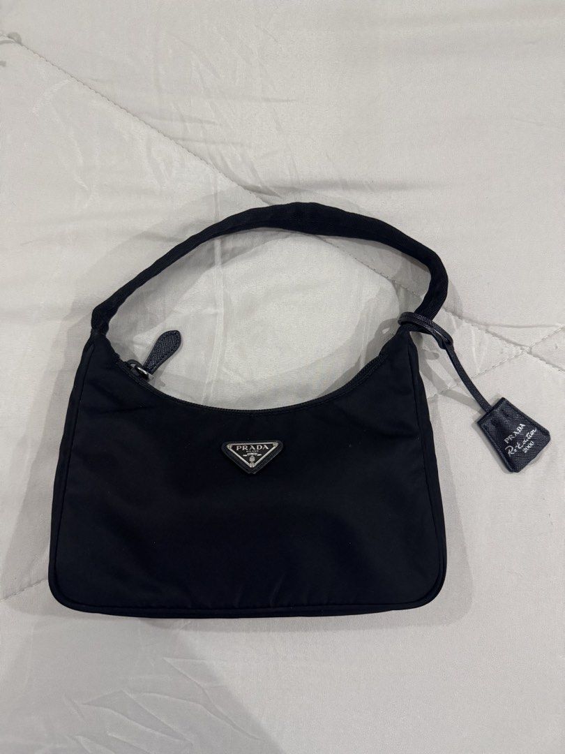 Prada Re-Edition 2000 Nylon Mini Bag Black (Category: Luxury Bags & Wallets) located in Quezon City. Submitted by eyabanana08 (Listing ID 1443074955, Image 1). Description: black prada re-ed bag barely used no signs of discoloration comes with dust bag only authentic, money back if proven fake dm price is nego.
