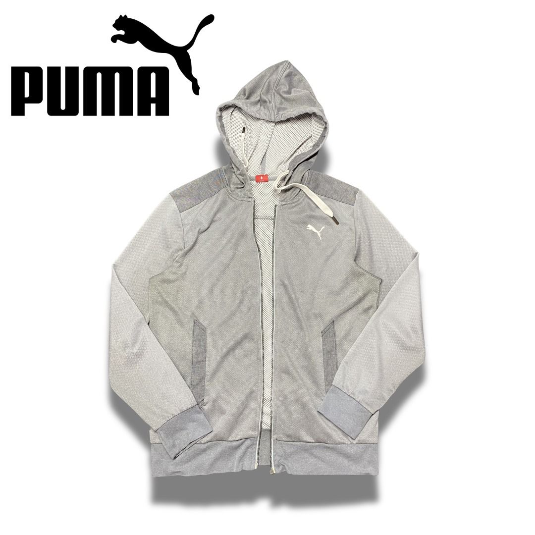 Puma Grey Zip-Up Hoodie Jacket (Category: Coats, Jackets and Outerwear) located in Valenzuela. Submitted by aplusmnl (Listing ID 1443114703, Image 1). Description: Width 20 Length 26 Issue: No Zipper - Grey Puma zip-up hoodie - Classic Puma logo on chest - Two front pockets - Drawstring hood - Comfortable and stylish - Ideal for casual wear or workouts.