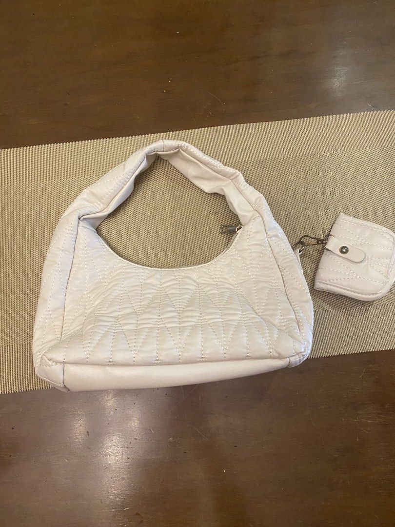 Quilted Shoulder Bag with Matching Pouch (Category: Luxury Bags & Wallets) located in Quezon City. Submitted by fayetersog25343 (Listing ID 1443052931, Image 1). Description: - Chic cream-colored quilted shoulder bag - Includes a small matching pouch - Main bag features a secure zipper closure - Pouch has a convenient snap button closure - Ideal for everyday use, fits all your essentials.