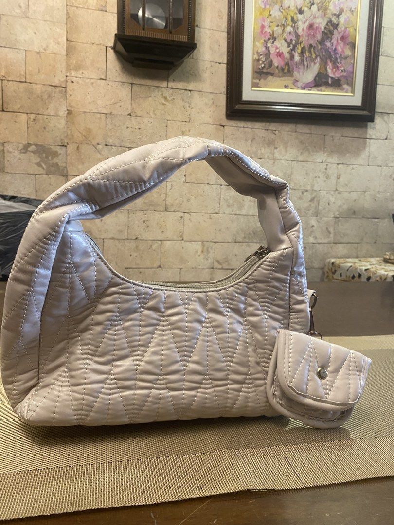 Quilted Shoulder Bag with Matching Pouch (Category: Luxury Bags & Wallets) located in Quezon City. Submitted by fayetersog25343 (Listing ID 1443052931, Image 2). Description: - Chic cream-colored quilted shoulder bag - Includes a small matching pouch - Main bag features a secure zipper closure - Pouch has a convenient snap button closure - Ideal for everyday use, fits all your essentials.