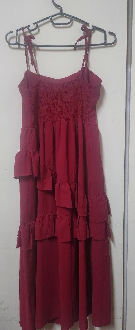 Red Tiered Ruffle Halter Neck Dress (Category: Dresses) located in Manila. Submitted by maybelle00 (Listing ID 1442931580, Image 2). Description: - Red halter neck dress - Features tiered ruffles down the front - Straps tie at the back - Estimated size: Small to Medium (S/M) - Ideal for parties or a night out.