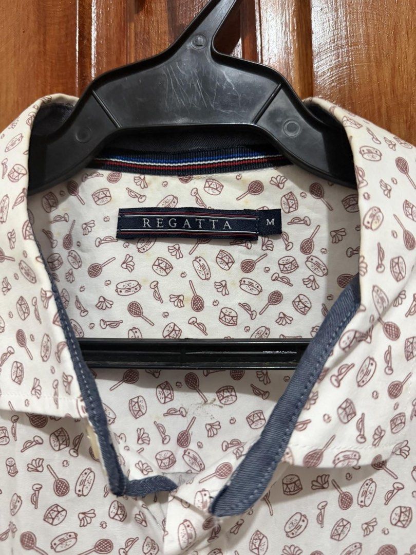 Regatta Short Sleeve Button Up Shirt Size M (Category: Shirts) located in Taguig. Submitted by geestuff27 (Listing ID 1443122196, Image 3). Description: - Brand: Regatta - Type: Short Sleeve Shirt - Color: Cream base - Print: Fun all-over musical instruments and candy - Features: Chest pocket with Regatta logo, button-up front - Size: Medium (M) - Occasion: Casual wear.