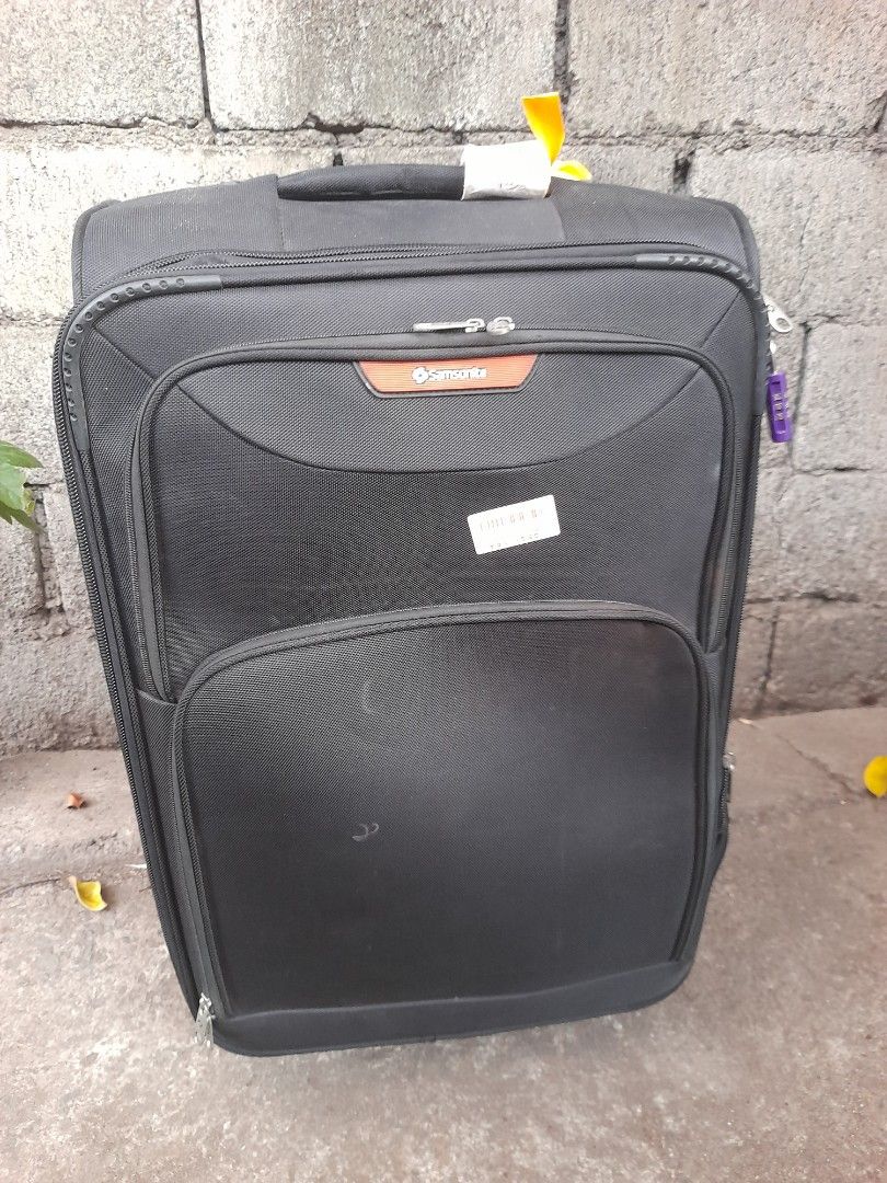 Samsonite Black Softside Spinner Luggage (Category: Luggage) located in Valenzuela. Submitted by newbear.425b6e (Listing ID 1442981587, Image 1). Description: - Brand: Samsonite - Color: Black - Type: Softside Spinner Luggage - Size: Approximately 28 inches tall - Features: Retractable handle, smooth-rolling wheels, multiple zippered compartments for organization - Ideal for: Travel -surplus.